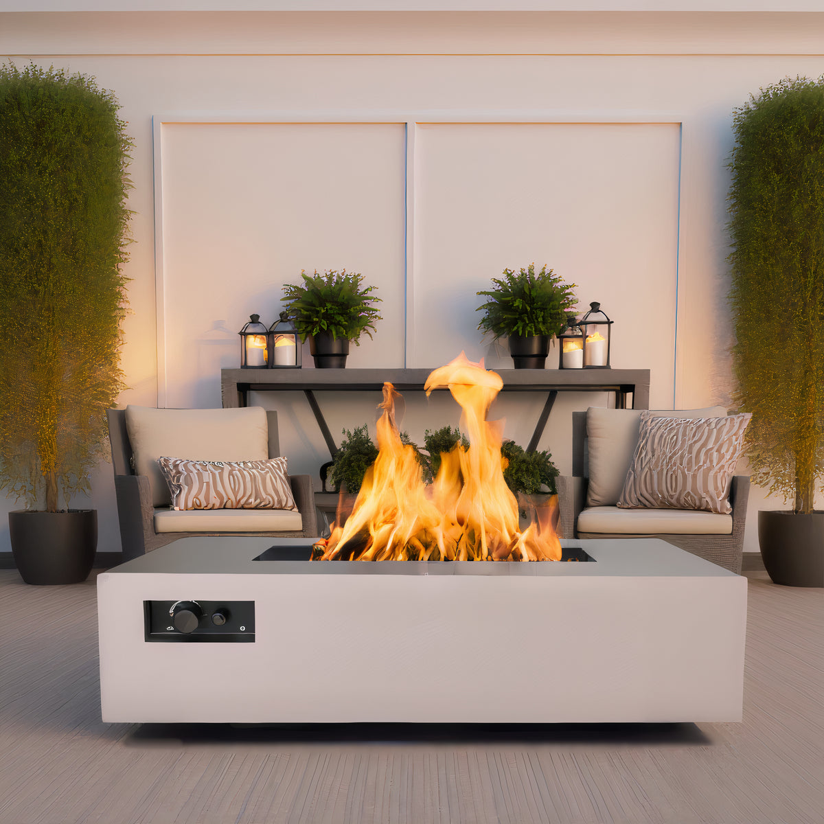 Warming Trends AON rectangular fire table in Sand Pebble on a patio with two chairs