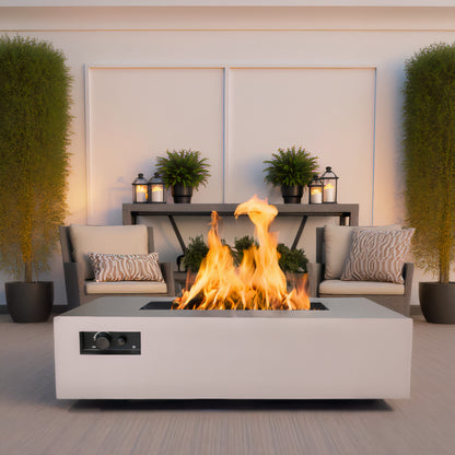 Warming Trends AON rectangular fire table in Sand Pebble on a patio with two chairs