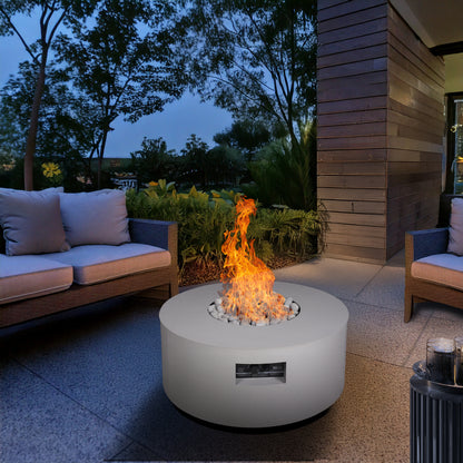 Warming Trends AON round fire table in Sand Pebble on a patio