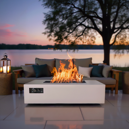 Warming Trends AON rectangular fire table in Sand Pebble by a lake